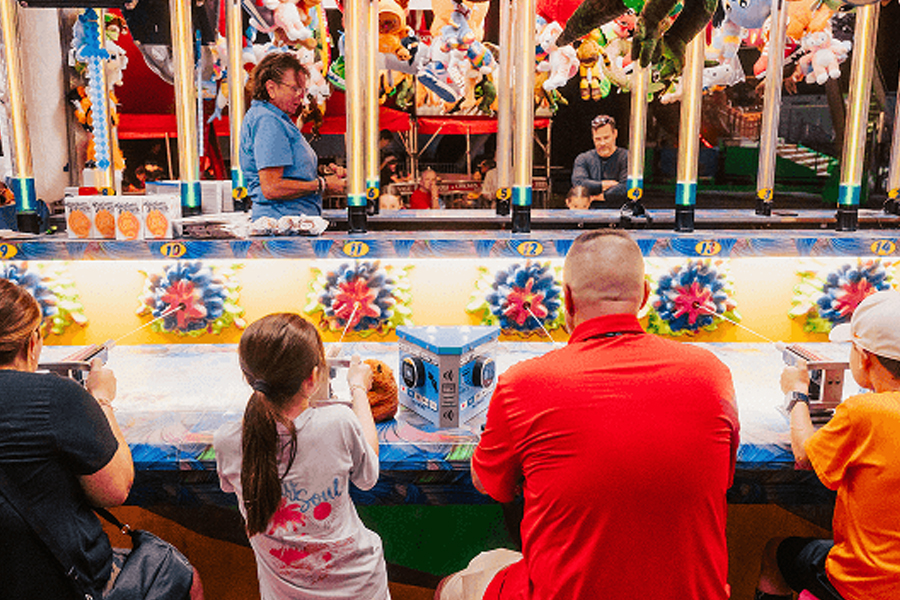 Families enjoying the carnival midway.