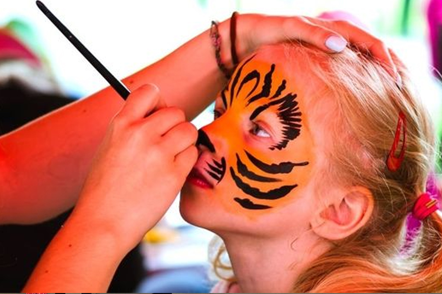 Children in Halloween costumes enjoying a family event.